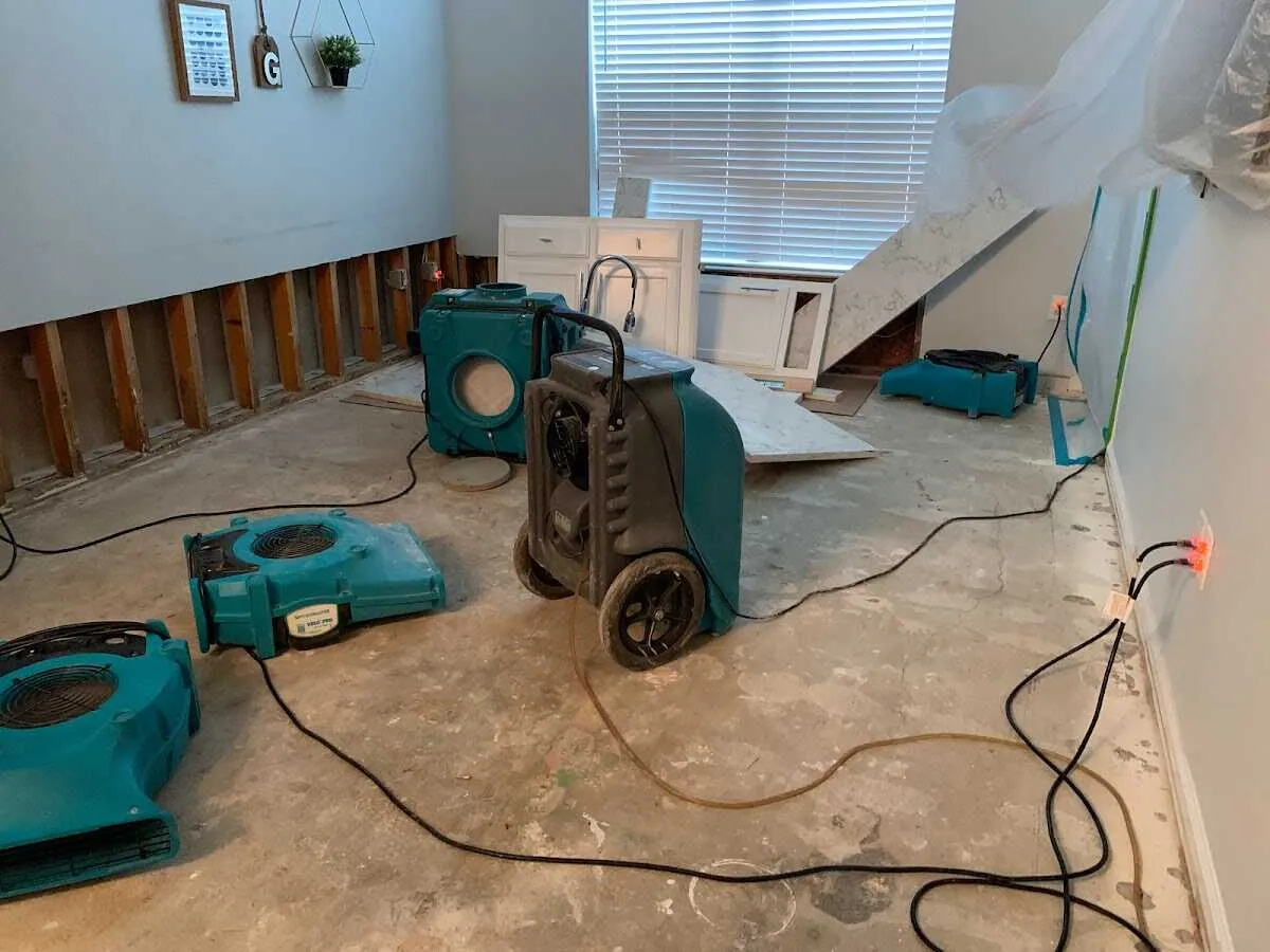 Dehumidifier in flood-cut room for Water Damage Restoration in Salem